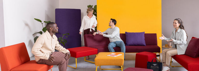 Dauphin muli-colored Reefs flex sofa system with people lounging.