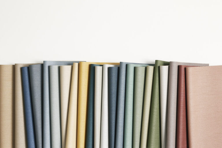 A row of various colors of samples arranged neatly on a white background.